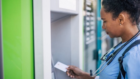 Nurse uses healthcare Cash-to-Card Kiosk