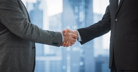 Hotel Business Partners Shaking Hands