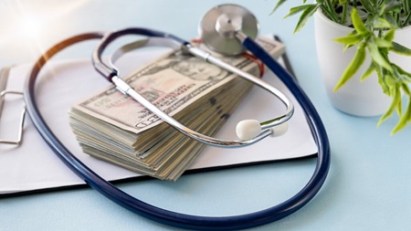 Cash and stethoscope