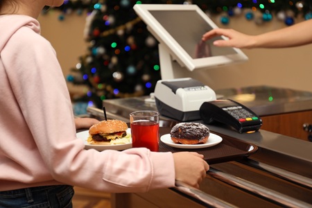 Student uses cashless payment option at university cafeteria